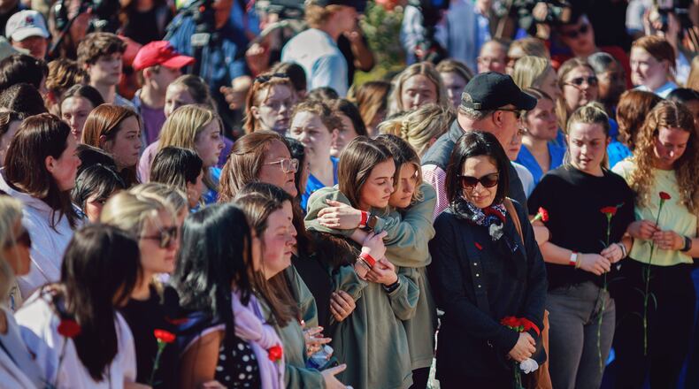 Students attended a vigil after 22-year-old Laken Riley was killed near the University of Georgia's intramural fields Feb. 22.