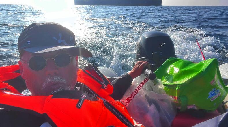 In this photo released by Dong Guangping, Dong Guangping is seen on a dinghy, crossing the sea between China and South Korea, on May 24, 2026. (Dong Guangping via AP)
