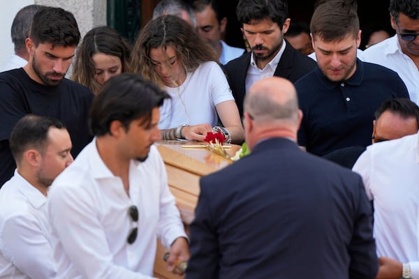 Diogo Jota's wife Rute Cardoso reacts next to the coffin of his husband, during his funeral in Gondomar, near Porto, Portugal, on Saturday, July 5, 2025. (AP Photo/Manu Fernandez)