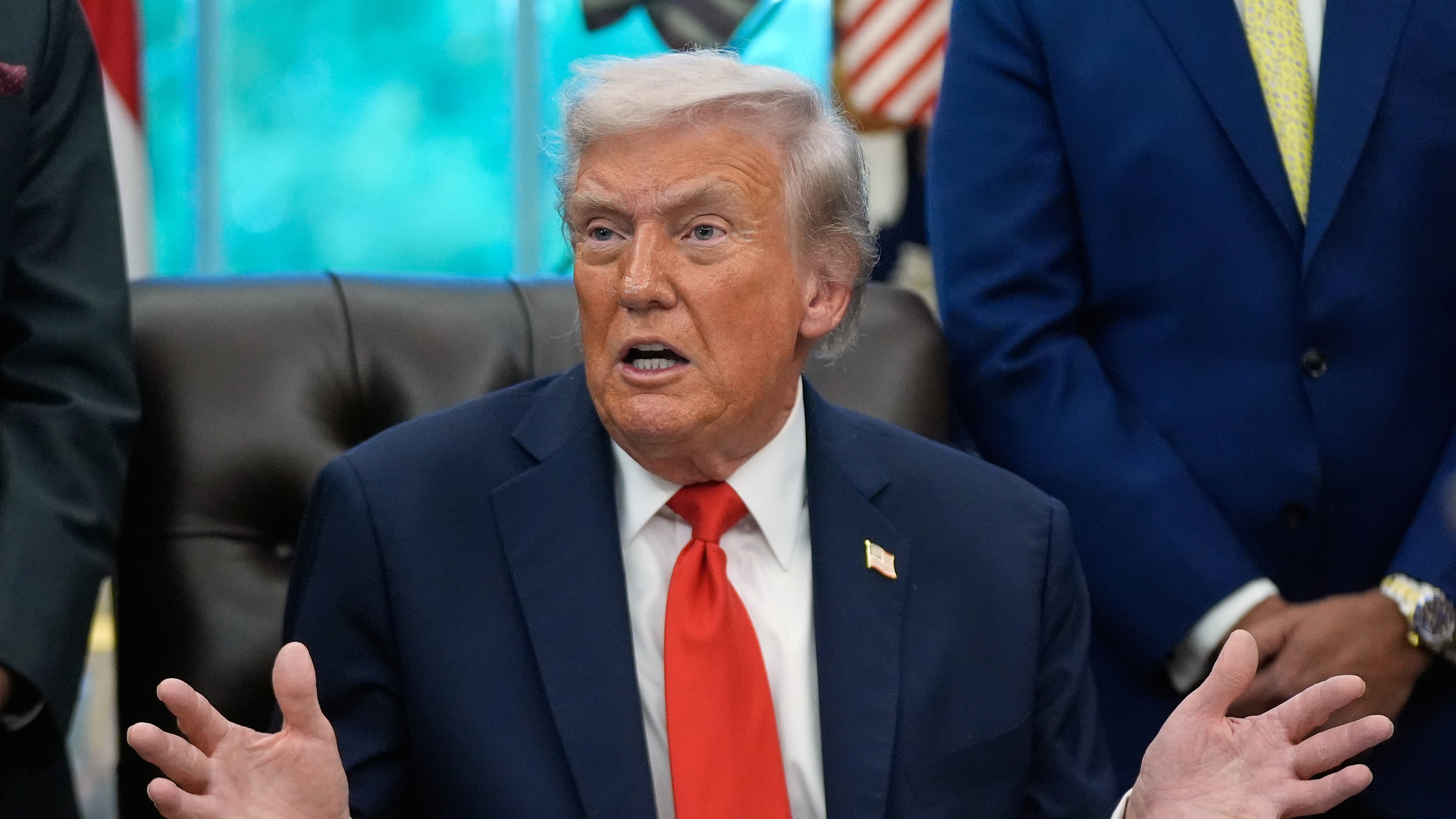 President Donald Trump answers questions from reporters during a Diwali celebration in the Oval Office at the White House, Tuesday, Oct. 21, 2025, in Washington. (AP Photo/Manuel Balce Ceneta)