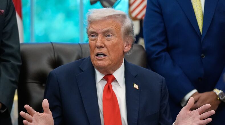 President Donald Trump answers questions from reporters during a Diwali celebration in the Oval Office at the White House, Tuesday, Oct. 21, 2025, in Washington. (AP Photo/Manuel Balce Ceneta)