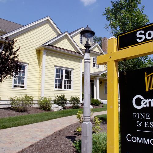 FILE - A sold sign is posted outside a newly constructed luxury home in Wellesley, Mass., Aug. 25, 2009. (AP Photo/Charles Krupa, File)