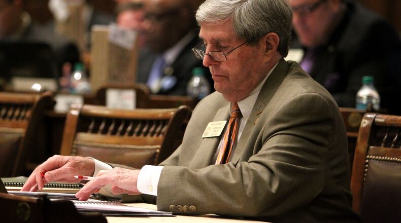 Feb. 1, 2012-ATLANTA: Rep. Harry Geisinger, R-Roswell, works at his desk during Legislative Day 12 in the House Chambers Wednesday afternoon in Atlanta, Ga., February 1, 2012. Six north Fulton legislators, including Geisinger, want to give Georgia's highest-paid public official a massive pay cut. A bill introduced by Rep. Lynne Riley, R-Johns Creek, would nullify the contracts that Fulton County Tax Commissioner Arthur Ferdinand has with three cities, which last year paid him a combined $212,600 in personal fees for collecting their taxes. Jason Getz jgetz@ajc.com State Rep. Harry Geisinger, R-Roswell. AJC file