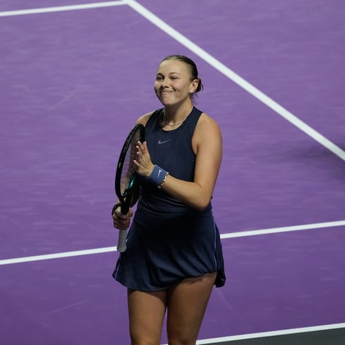 Amanda Anisimova of the United States celebrates after winning her women's singles match against Iga Swiatek of Poland at the WTA tennis finals in Riyadh, Saudi Arabia, Wednesday, Nov. 5, 2025. (AP Photo/Fatima Shbair)