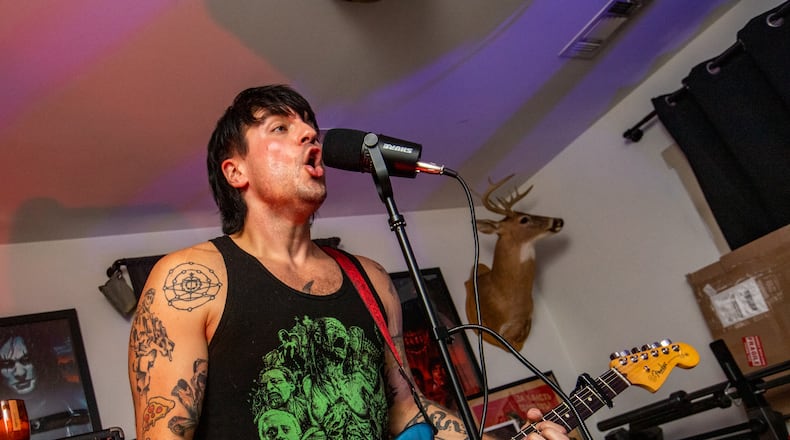 Dusty Gannon, also know as Goth Dad, practices with his band, Vision Video, in the week leading up to AthFest, the beloved outdoor music festival in Athens. Vision Video headlined the Saturday night performances for the first time, a big step for the band. which includes bass player Dan Geller, Emily Fredock on vocals and synthesizer and drummer Jason Fusco. (Jenni Girtman for The Atlanta Journal-Constitution)