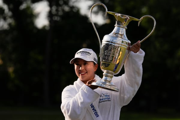 Mao Saigo, of Japan, holds the trophy after winning the Chevron Championship LPGA golf tournament Sunday, April 27, 2025, in The Woodlands, Texas. (AP Photo/Ashley Landis)