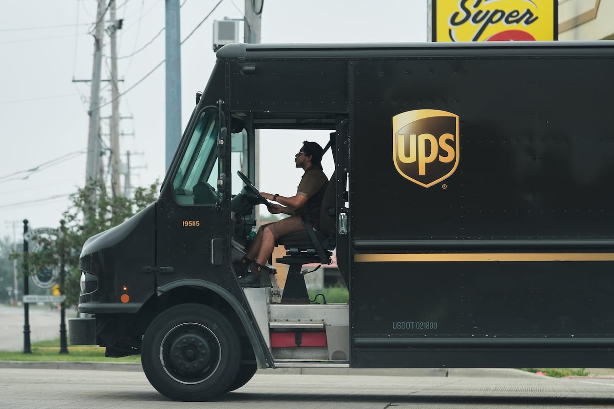 A UPS truck driver makes a delivery Wednesday, June 25, 2025, in River Forest, Ill. The first 2,000 retrofitted vehicles with AC are set to be ready by June 1, 2026, with all 5,000 to be finished by June 1, 2027, the Teamsters union said. (Nam Y. Huh/AP)
