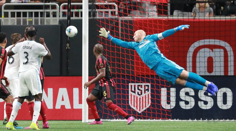August 27, 2019 Atlanta: Atlanta United goalkeeper Brad Guzan defends a shot by Minnesota United Ike Opara during the first half in the final for the U.S. Open Cup on Tuesday, August 27, 2019, in Atlanta.  Curtis Compton/ccompton@ajc.com
