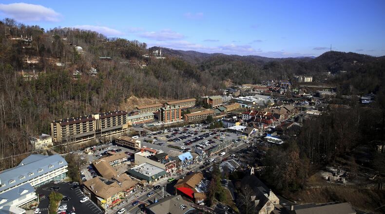 The view from the Space Needle shows Gatlinburg, Tenn., as the resort city reopens to the public on Friday, Dec. 9, 2016, nearly two weeks after a devastating wildfire. Most of the main tourist area in Gatlinburg was spared by the fires that were whipped into the city by hurricane-force winds the night of Nov. 28, and officials are keen for people to return to the city with a population of less than 4,000 that draws more than 11 million visitors a year. (Caitie McMekin/Knoxville News Sentinel via AP)