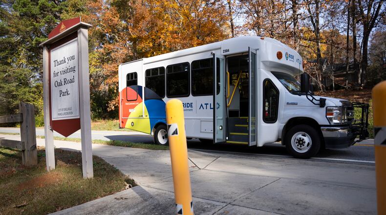 The Gwinnett Micro Transit bus pulls up to a suburban park to pick up passengers in Snellville, Georgia on Wednesday, Nov. 27, 2024 (Olivia Bowdoin for the AJC).