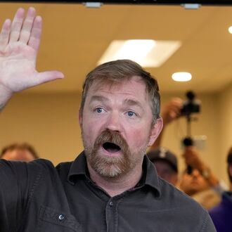 Democratic U.S. Senate candidate Graham Platner speaks to a crowd outside a campaign event last month in Portland, Maine. (Robert F. Bukaty/AP)