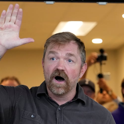 Graham Platner, Democratic candidate for U.S. Senate, speaks to an overflow crowd outside a campaign event Sunday, June 7, 2026, in Portland, Maine. (AP Photo/Robert F. Bukaty)