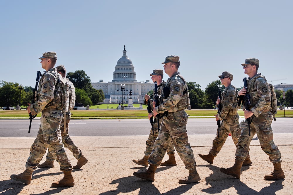 Armed National Guard soldiers patrolled the area near the Capitol in Washington on Tuesday.