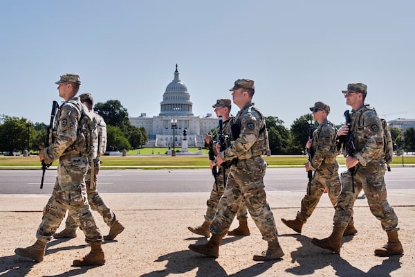 Armed National Guard soldiers patrolled the area near the Capitol in Washington on Tuesday.