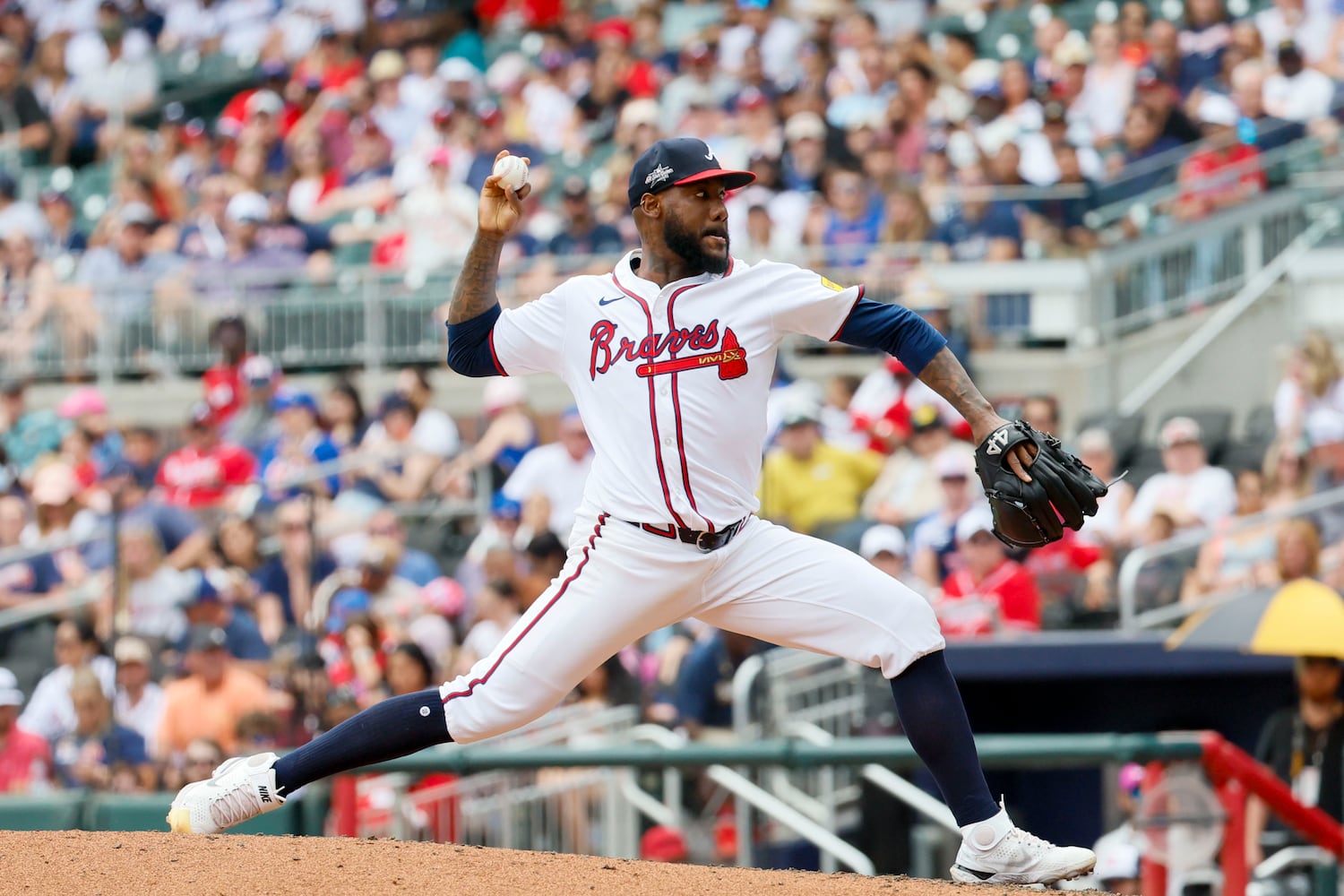 Atlanta Braves pitcher Enyel De Los Santos (61) delivers to a Minnesota Twins batter during the sixth inning at Truist Park on Sunday, April 20, 2025, in Atlanta. 
(Miguel Martinez/ AJC)