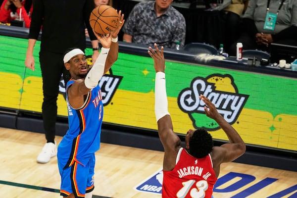 Oklahoma City Thunder guard Shai Gilgeous-Alexander (2) shoots the ball over Memphis Grizzlies forward Jaren Jackson Jr. (13) during the second half in Game 4 of an NBA basketball first-round playoff series Saturday, April 26, 2025, in Memphis, Tenn. (AP Photo/George Walker IV)