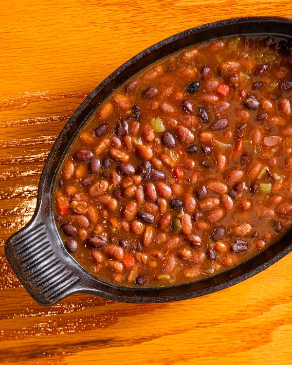 Michele Tomkins' home cook recipe for Two Bean Baked Beans uses grocery store ingredients that come together quickly. (Aaliyah Man for the AJC/food styling by Michele Tomkins)