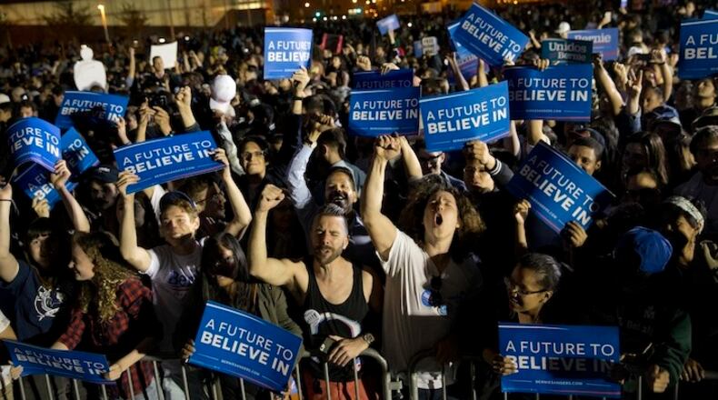 Supporters cheer during a campaign rally for Democratic presidential candidate Bernie Sanders, I-Vt., at Hunters Point park, Monday, April 18, 2016, in the Queens borough of New York. (AP Photo/Mary Altaffer)