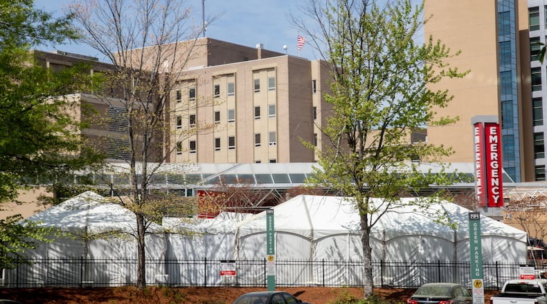 The newly constructed tents stand outside of Northside Hospitals' Emergency Department are built in anticipation of a surge of COVID-19 patients as seen here on March 30, 2020. (Photo: STEVE SCHAEFER / SPECIAL TO THE AJC)