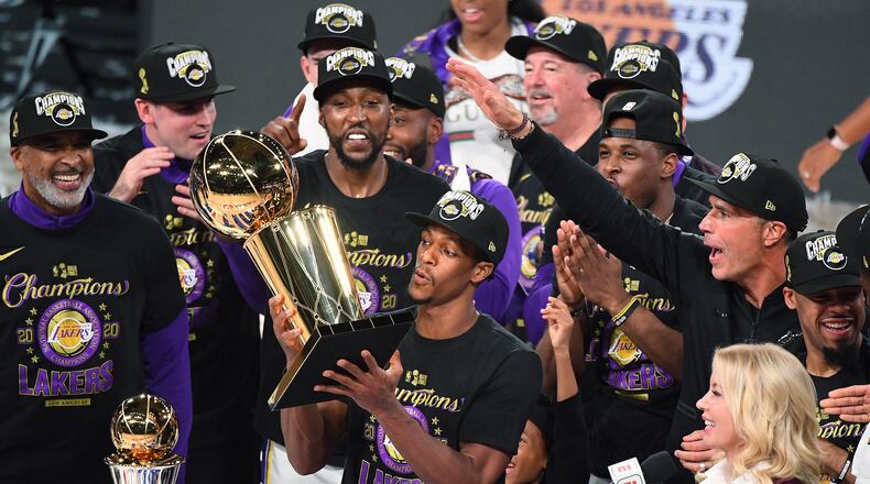 Los Angeles Lakers' Rajon Rondo takes the trophy after the Lakers defeated the Miami Heat to win the NBA Championship in Game 6 of the NBA Finals on Sunday, Oct. 11, 2020 in Orlando, Florida. (Wally Skalij/Los Angeles Times/TNS)