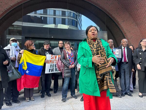 Immigration advocates speak Thursday, April 10, 2025, outside federal court in Boston, after a hearing aiming to halt the Trump administration's from stopping a program that allowed hundreds of thousands of Cubans, Haitians, Nicaraguans, and Venezuelans to temporarily live in the country. (AP Photos/Michael Casey)