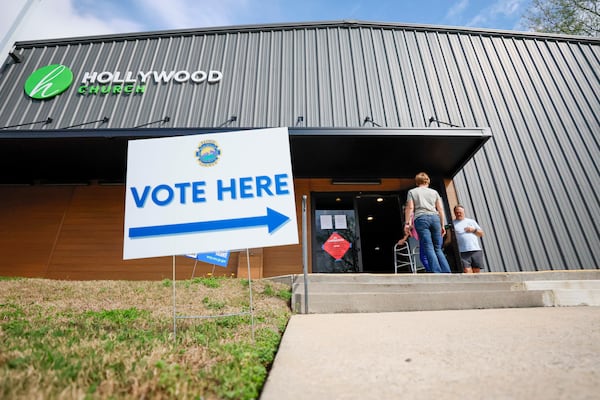 Voters enter and exit the Hollywood Baptist Church during the special election to replace Marjorie Taylor Greene in U.S. House District 14 in March. (Miguel Martinez/AJC)