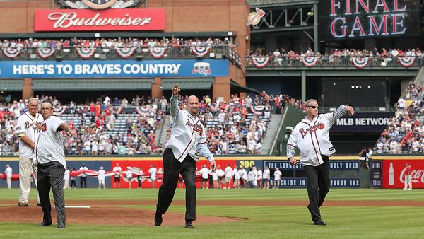 Hall of Fame manager Bobby Cox (far left) looks on as Hall of Fame pitchers (from left) Greg Maddux, John Smoltz, and Tom Glavine throw out the first pitch for the Braves final game at Turner Field, in Atlanta. The team moved to a new stadium in Cobb County for the 2017 season. (Curtis Compton/AJC 2016)
