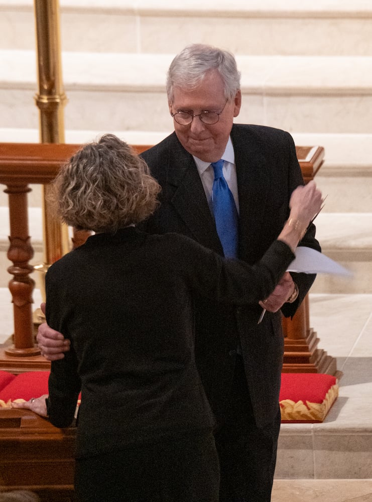 220106-Atlanta- CORRECTS SPELLING OF DIANNE -Sen. Mitch McConnell embraces Sen. Johnny Isakson’s widow, Dianne, after speaking during his funeral at Peachtree Road United Methodist Church on Thursday afternoon, Jan. 6, 2022. Ben Gray for the Atlanta Journal-Constitution