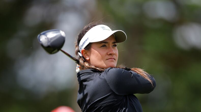 Kiara Romero watches her tee shot on the ninth hole during the first round of the Meijer LPGA Classic golf tournament, Thursday, June 18, 2026, in Belmont, Mich. (AP Photo/Al Goldis)