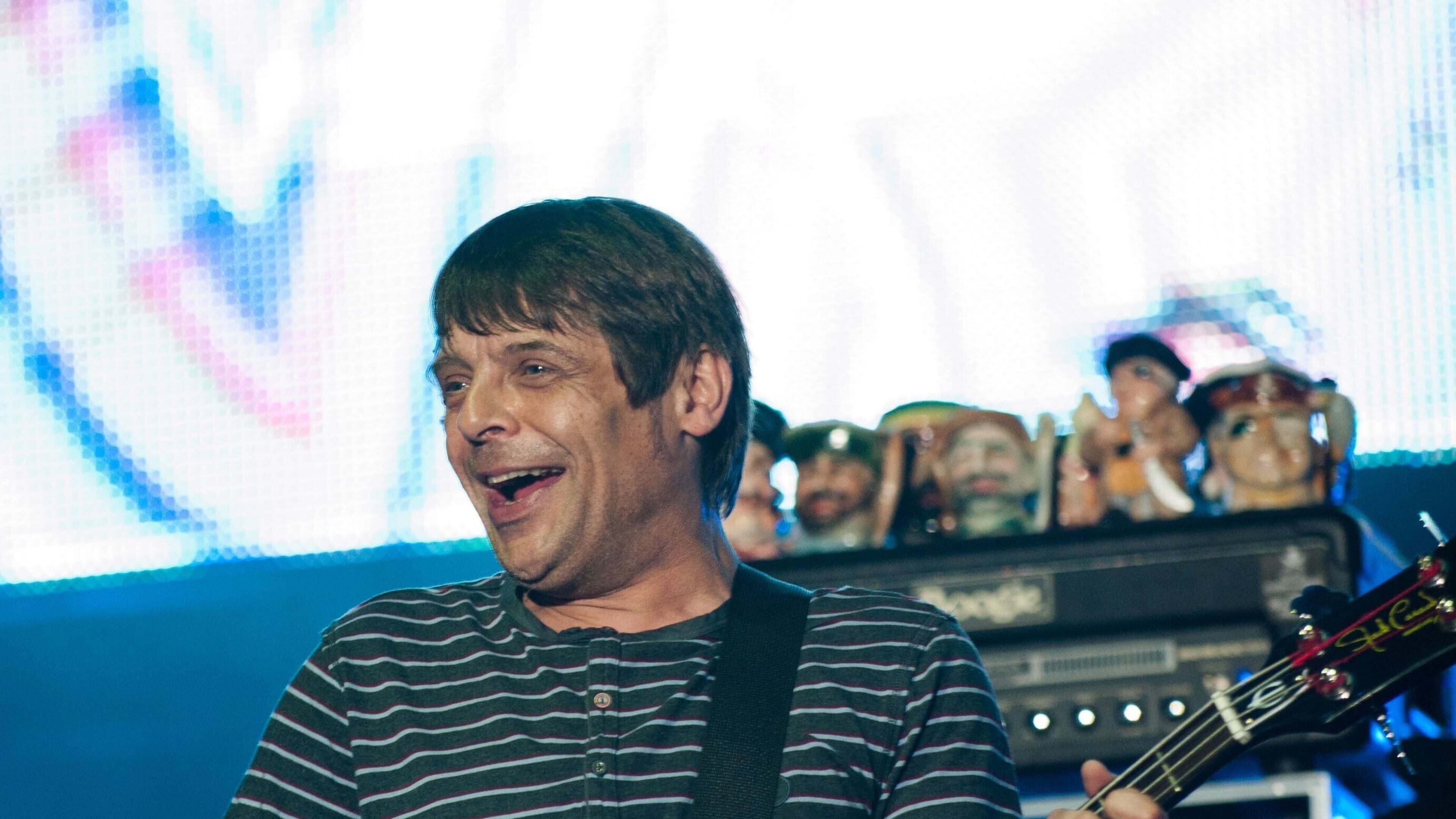 FILE - Bassist Gary "Mani" Mounfield of The Stone Roses performs on the main stage at the V Festival in Weston Park, England, Aug. 19, 2012. Gary Mounfield, the former bass player of the Stone Roses and Primal Scream, has died aged 63. (Ryan Phillips/PA via AP, File)