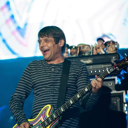 FILE - Bassist Gary "Mani" Mounfield of The Stone Roses performs on the main stage at the V Festival in Weston Park, England, Aug. 19, 2012. Gary Mounfield, the former bass player of the Stone Roses and Primal Scream, has died aged 63. (Ryan Phillips/PA via AP, File)