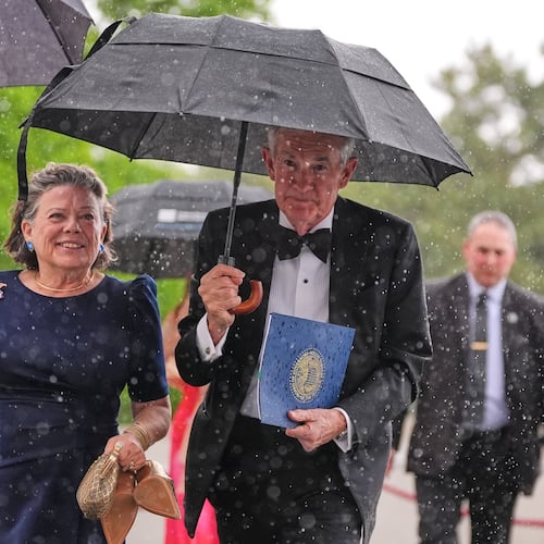 Federal Reserve Board Governor Jerome Powell, the former Federal Reserve chair, center, arrives with his wife Elissa Leonard, left, for the Profile in Courage Award at the John F. Kennedy Presidential Library, Sunday, May 31, 2026, in Boston. (AP Photo/Charles Krupa)