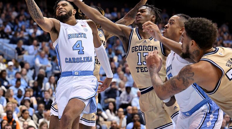 North Carolina's R.J. Davis (4) drives against Georgia Tech's Miles Kelly (13) during the second half at the Dean E. Smith Center on Saturday, Dec. 10, 2022, in Chapel Hill, North Carolina. (Grant Halverson/Getty Images/TNS)