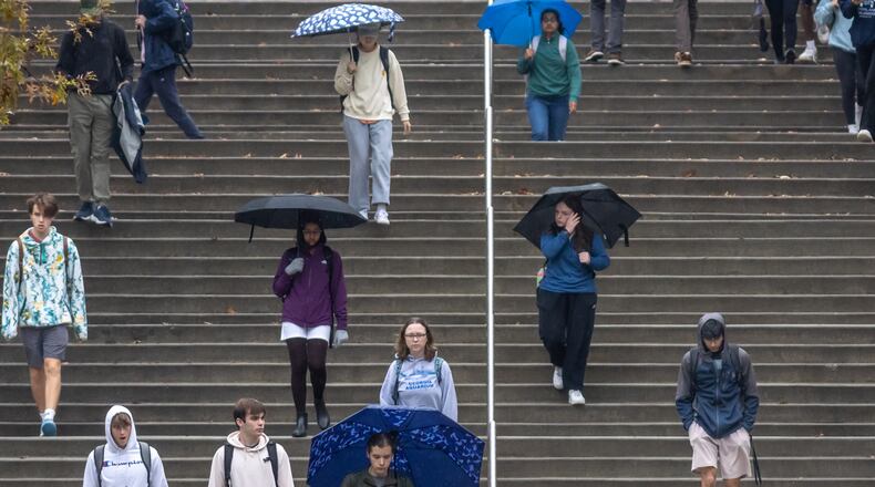 Georgia Tech students popped the umbrellas on campus on Tuesday, Nov. 19, 2024. Our guest writer hopes President Donald Trump can downsize federal student loan programs and tackle higher education’s inflated costs and mediocre performance. (John Spink/AJC)