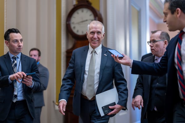 FILE — Sen. Thom Tillis, R-N.C., speaks with reporters as he heads to the chamber during a test vote to begin debate on a border security bill, at the Capitol in Washington, Feb. 7, 2024. (AP Photo/J. Scott Applewhite, File)