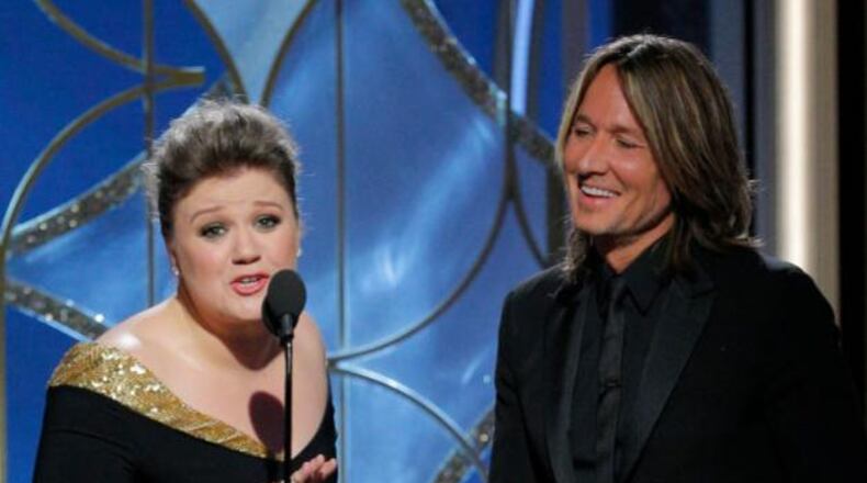 BEVERLY HILLS, CA - JANUARY 07: In this handout photo provided by NBCUniversal, Presenters Kelly Clarkson and Keith Urban speak onstage during the 75th Annual Golden Globe Awards at The Beverly Hilton Hotel on January 7, 2018 in Beverly Hills, California. (Photo by Paul Drinkwater/NBCUniversal via Getty Images)