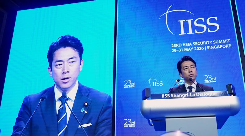 Japan's Defense Minister Shinjiro Koizumi delivers a speech during the Shangri-La Dialogue, Asia's annual defense and security forum, in Singapore, Sunday, May 31, 2026. (AP Photo/Achmad Ibrahim)