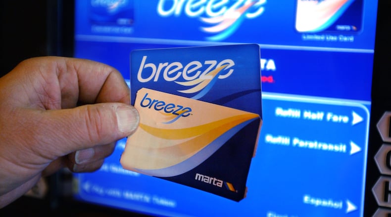 This 2005 photo shows the current MARTA Breeze Card (top) and the Breeze Ticket, which is currently available only to certain groups and special programs. MARTA will gradually phase out the blue Breeze Cards by mid-2017, replacing them with the new silver Card. Breeze Tickets will be available again to all riders at a cost of $1. (Kimberly Smith/AJC staff)