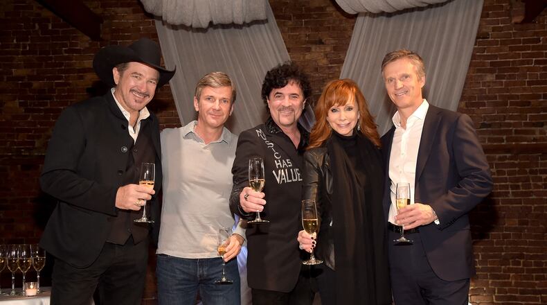 NASHVILLE, TN - DECEMBER 15: Kix Brooks, Lew Dickey of Cumulus Media, Scott Borchetta of Big Machine Label Group, Reba McEntire, and John Dickey of Cumulus Media attend the Inaugural Nash Icon ACC Awards post-show party honoring Reba as the first recipient of the NASH ICON Award at aVenue on December 15, 2014 in Nashville, Tennessee. (Photo by Rick Diamond/Getty Images for Big Machine)