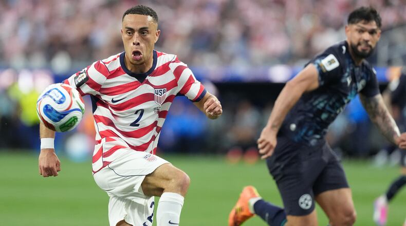 United States' Sergino Dest, left, controls a ball next to Paraguay's Omar Alderete during the World Cup Group D soccer match in Inglewood, Calif., near Los Angeles, Friday, June 12, 2026. (AP Photo/Jae C. Hong)