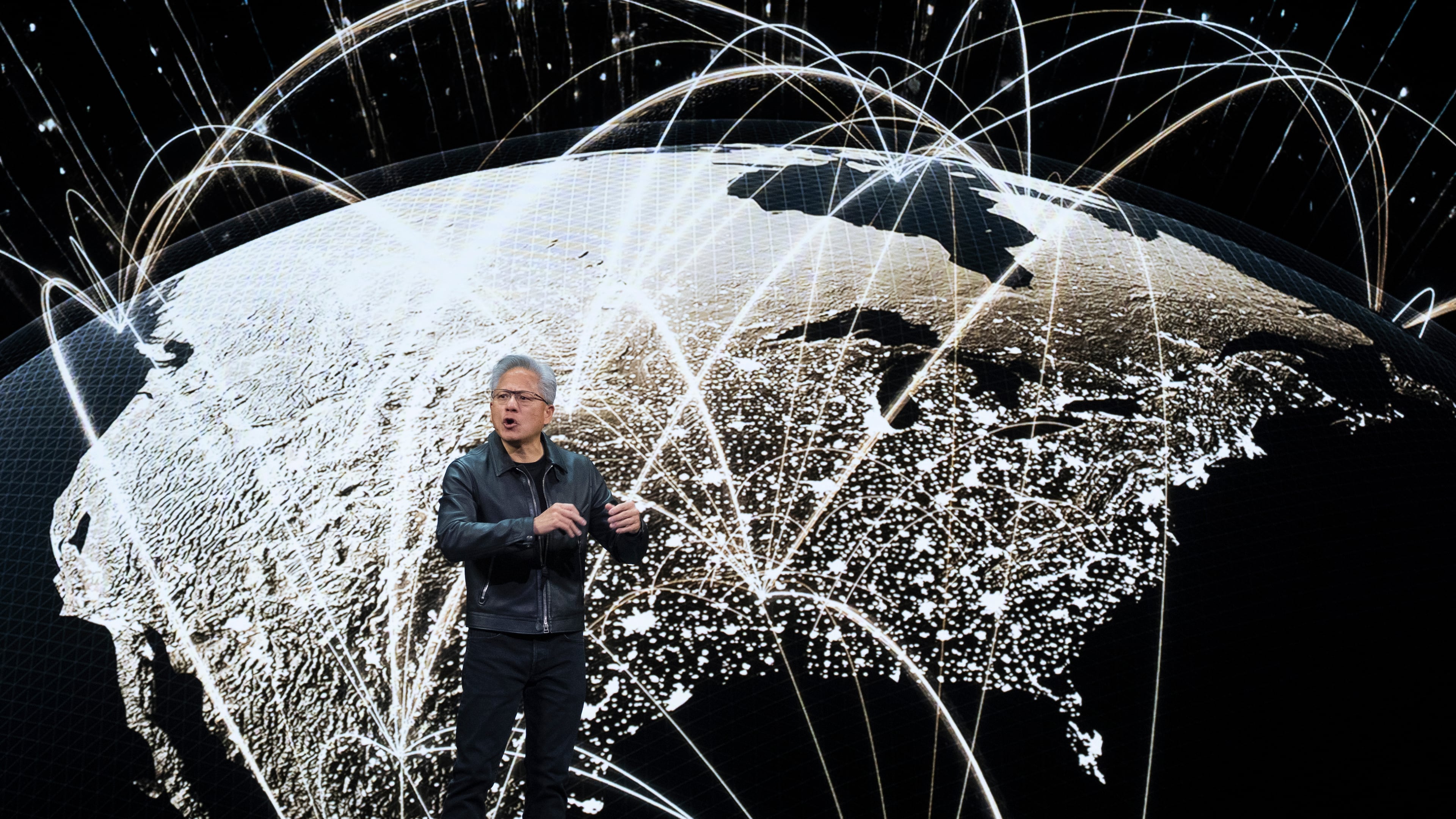 NVIDIA CEO Jensen Huang speaks on how AI infrastructure and AI factories that generate intelligence at scale are powering a new industrial revolution, at Washington Convention Center, Tuesday, Oct. 28, 2025, in Washington. (AP Photo/Manuel Balce Ceneta)