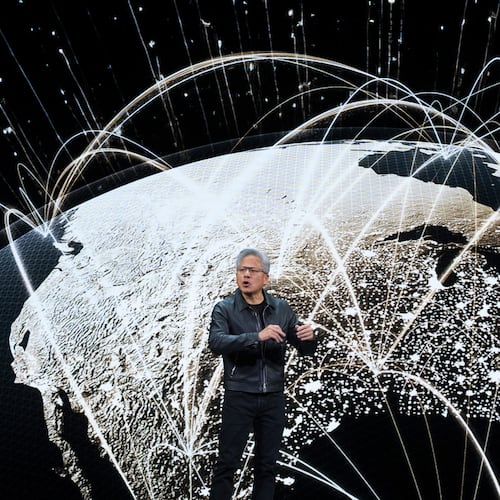 NVIDIA CEO Jensen Huang speaks on how AI infrastructure and AI factories that generate intelligence at scale are powering a new industrial revolution, at Washington Convention Center, Tuesday, Oct. 28, 2025, in Washington. (AP Photo/Manuel Balce Ceneta)
