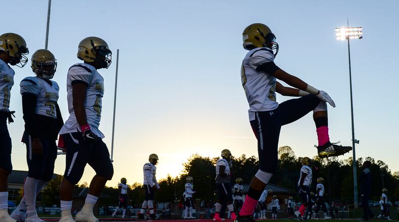 The Hapeville Charter Hornets run warmup drills prior to the start of their game Friday, October 12, 2018 at Allatoona High School. PHOTO/Daniel Varnado
