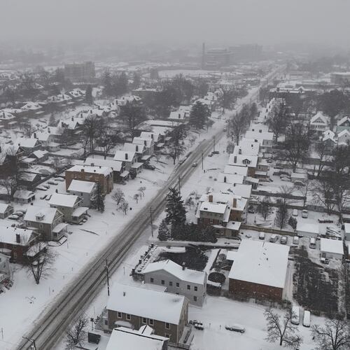 FILE - Snow covers homes during a winter storm in Cincinnati, Jan. 6, 2025. (AP Photo/Joshua A. Bickel, File)