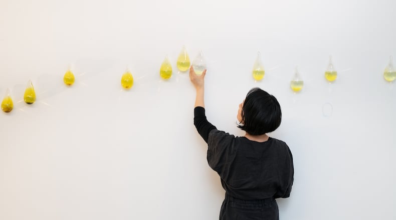 Gyun Hur with an installation of “Our mothers, our water, our peace” in her studio, 2024. The artist is attempting to create a platform for communal healing following the 2021 murder of six women of Asian descent by a white man at Atlanta area spas.