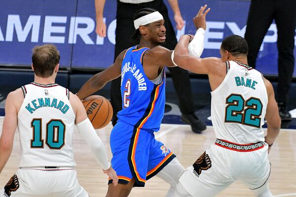 Oklahoma City Thunder guard Shai Gilgeous-Alexander (2) handles the ball against Memphis Grizzlies guard Desmond Bane (22) in the second half of Game 3 of an NBA first-round playoff series Thursday, April 24, 2025, in Memphis, Tenn. (AP Photo/Brandon Dill)