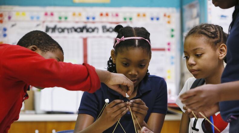 Brian Moore (from left), Noa Walker and Za’Riyah Jones build a bridge out of spaghetti and marshmallows, part of an experiment for a class segment on types of bridges at Chapel Hill Elementary School in DeKalb County. In 2006, Georgia education officials touted the growing numbers of minority and disadvantaged students flowing into gifted classes. But an analysis by The Atlanta Journal-Constitution shows black students still lag significantly behind their white counterparts in gifted programs. And the gap is wide when it comes to poor students. BOB ANDRES / BANDRES@AJC.COM