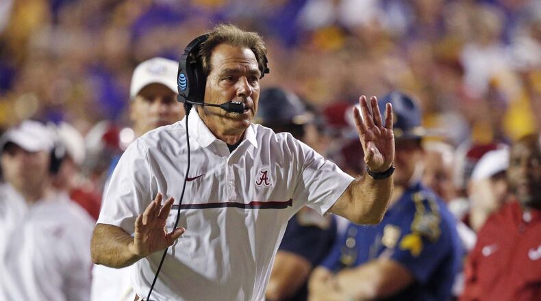 Alabama coach Nick Saban tries to get the referee’s attention as the play clock approaches zero in the second half at LSU on Nov. 5. Alabama won 10-0. (AP Photo/Gerald Herbert)