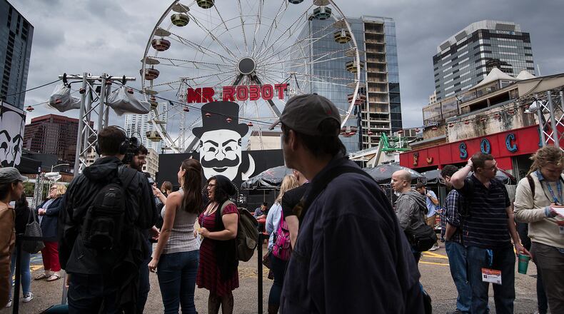 USE THIS PHOTO
SXSW Interactive began Friday, March 11, 2016 and the crowd began to gather around various locations in downtown Austin. A Mr. Robot ferris wheel stands at the corner of 4th Street and Congress Avenue. According to IMDb Mr. Robot is about "Young, anti-social computer programmer Elliot works as a cybersecurity engineer during the day, but at night he is a vigilante hacker." LAURA SKELDING/AMERICAN-STATESMAN