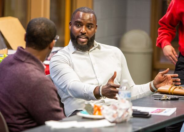 DeMario Pressley (right) attends his second board meeting at the YMCA in Cumming. The former NFL player volunteered there throughout his career and has now joined the board of the Forsyth County Family YMCA. The Y is where he was introduced to sports in middle school, and it's the place where he sought refuge from a dangerous neighborhood. PHIL SKINNER FOR THE ATLANTA JOURNAL-CONSTITUTION.